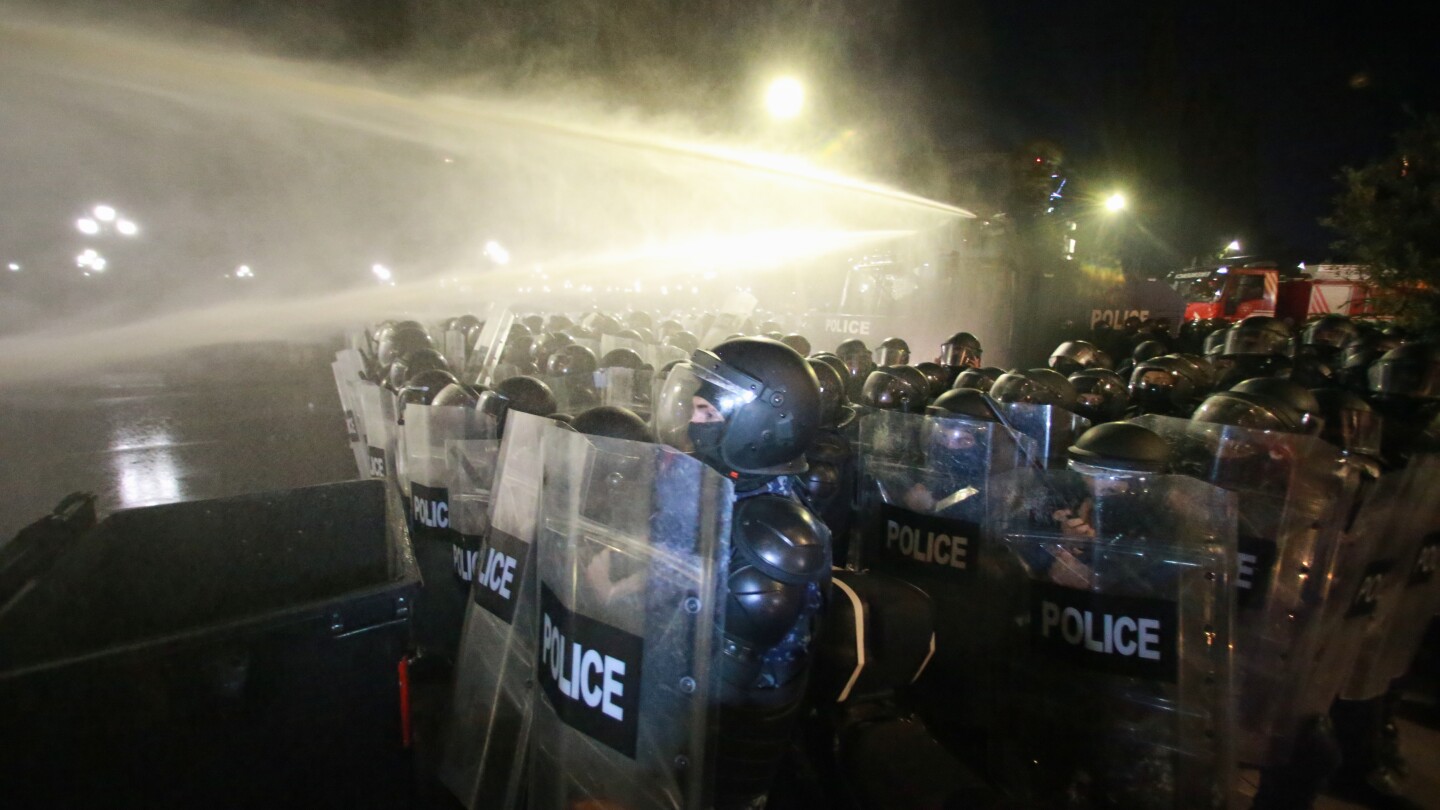 Georgia’s police use water cannons to push back protesters trying to storm presidential palace